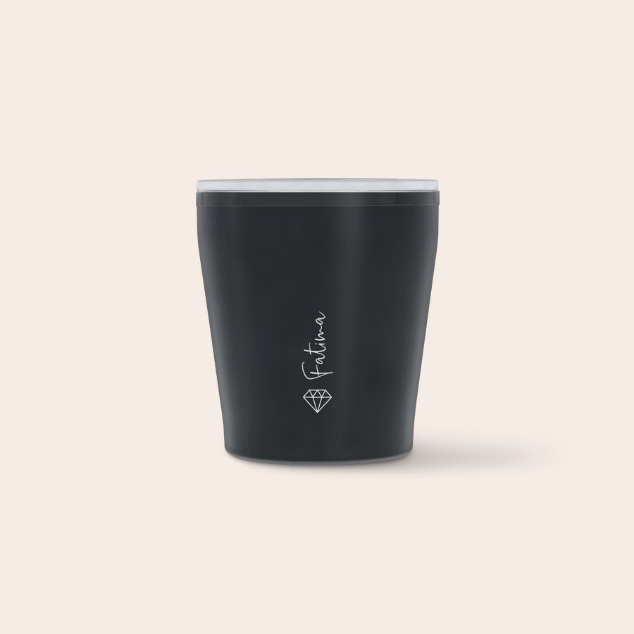 A dark grey personalised travel mug with a clear lid, printed with the name Fatima and a diamond graphic, for sipping in style while on the go.
