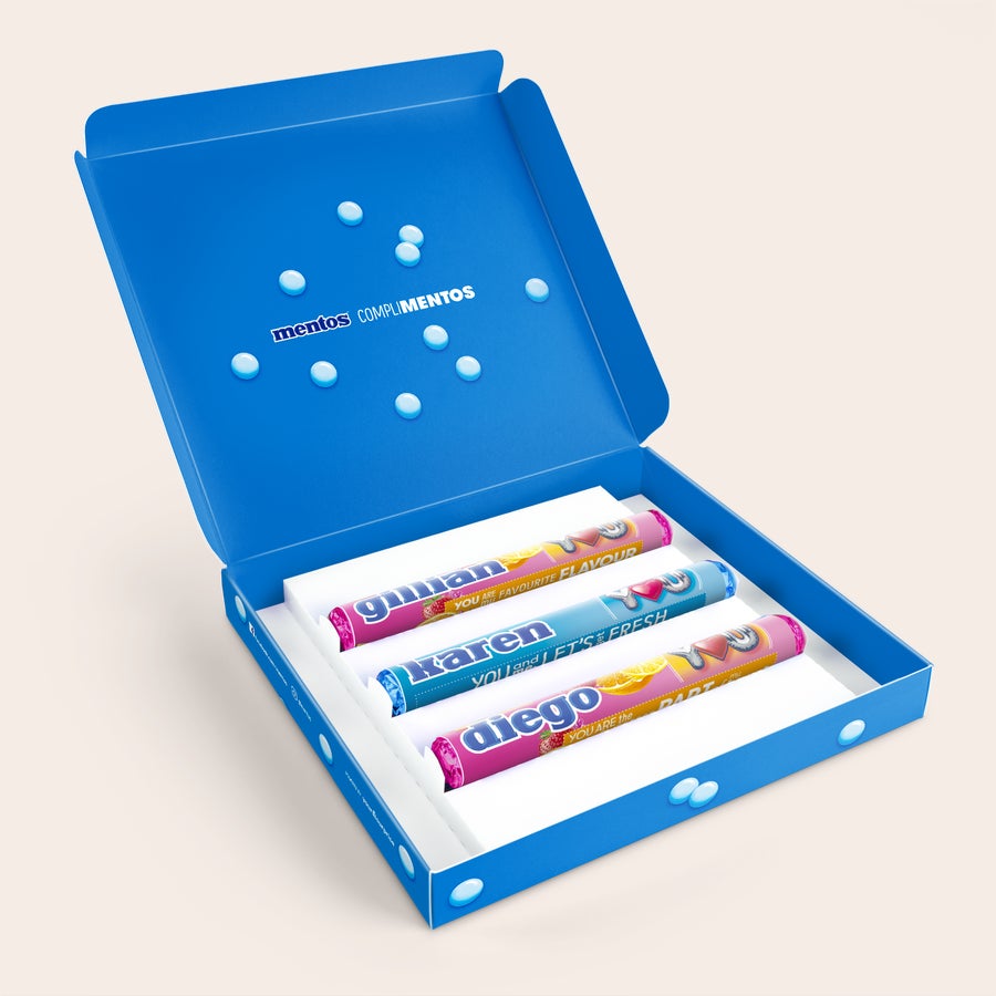 Blue personalized Mentos gift box with three custom-printed Mentos rolls inside.