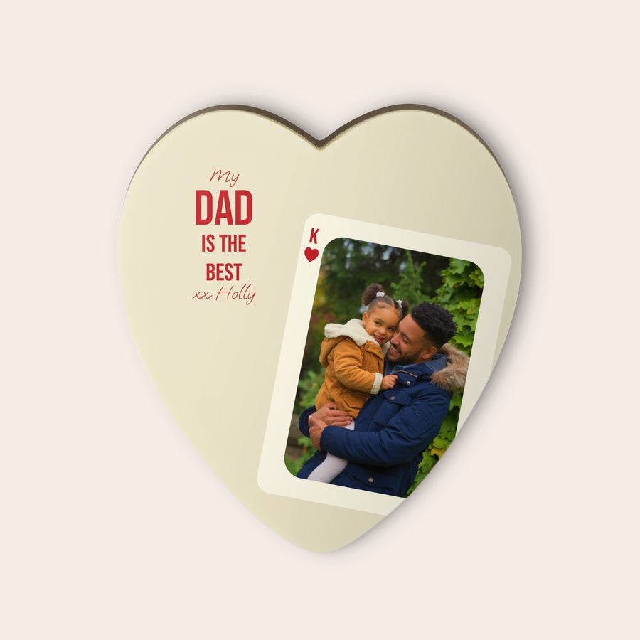 Heart-shaped personalized chocolate printed with a photo of a dad holding a child, and a message "My Dad is the best xx Holly." This personalized chocolate heart is sure to win their heart.