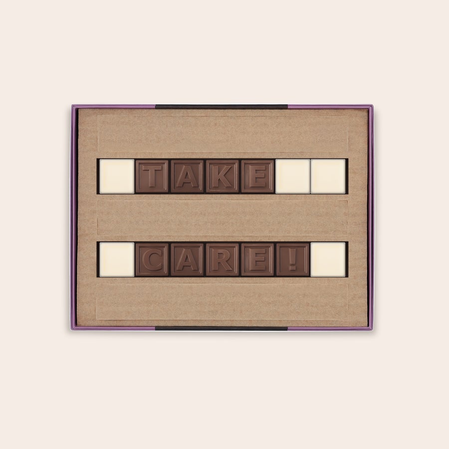 Personalised Chocolate Telegram A personalized chocolate telegram spelling out TAKE CARE in a gift box with milk and white chocolate letters