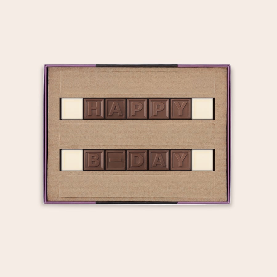 Personalized chocolate telegram in a gift box spelling HAPPY B-DAY with milk and white chocolate letters