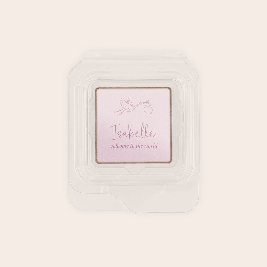 Individually wrapped chocolate favours printed with "Isabelle welcome to the world" and a stork design