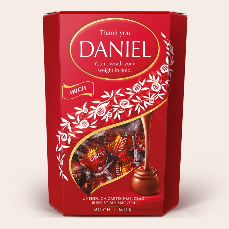 Personalized red Lindt Chocolate Gift Box with Daniel and a thank you message, ideal for chocoholics.
