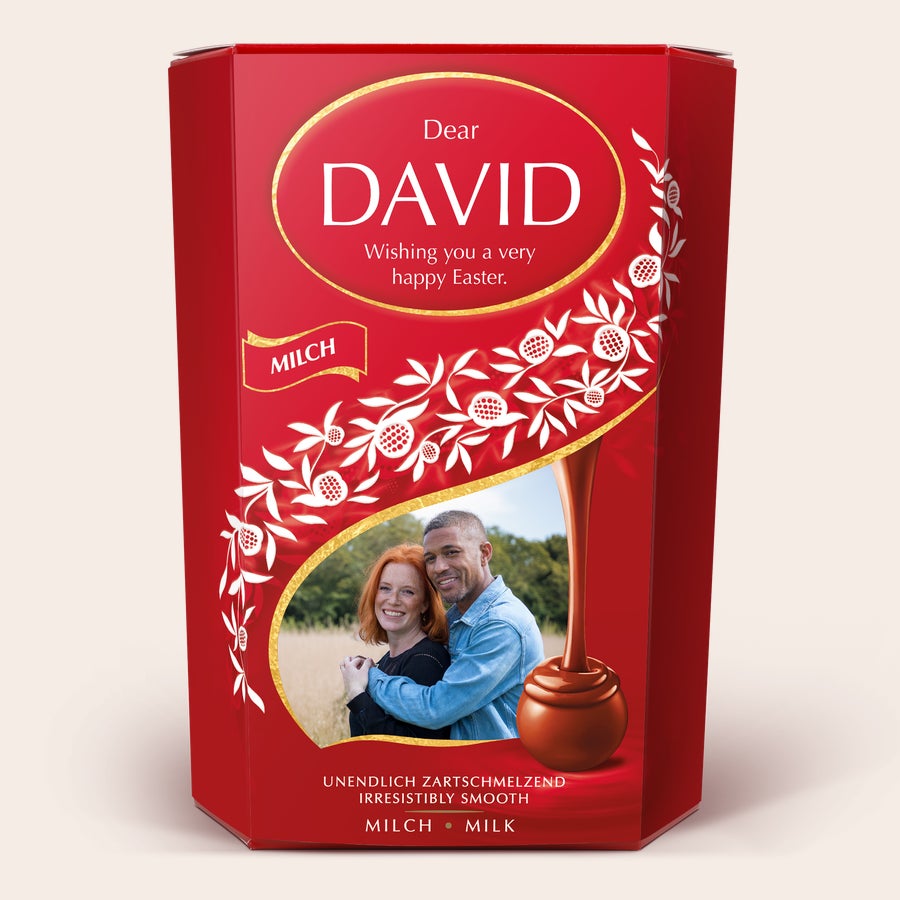 Lindt chocolate gift box Red Lindt Chocolate Gift Box with a photo of a couple and personalized text wishing David a Happy Easter. This Lindt Chocolate Gift Box is the perfect gift for chocoholics.
