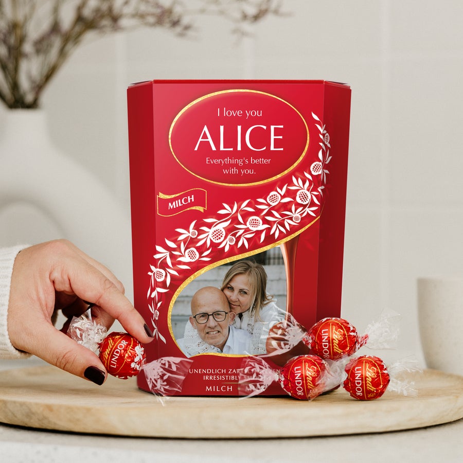 Personalized Lindt Chocolate Gift Box printed with a photo of a couple and the text "I love you ALICE". This Lindt Chocolate Gift Box is the perfect gift for chocoholics.