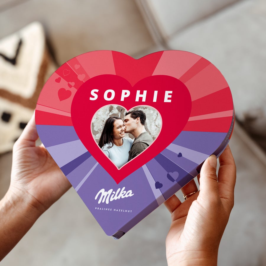 A personalised Milka heart-shaped chocolate box with a printed photo of a couple and the name Sophie
