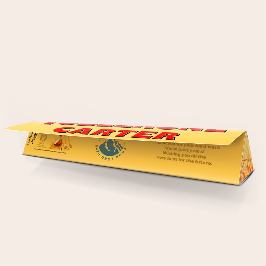 A personalized Large Toblerone bar with the name CARTER and a thank you message printed on the wrapper