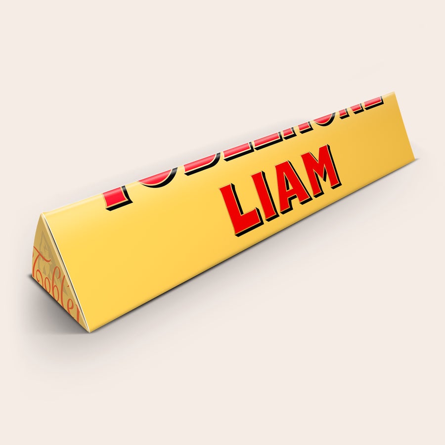 Personalized Large Toblerone bar with the name LIAM printed in red letters on the yellow wrapper