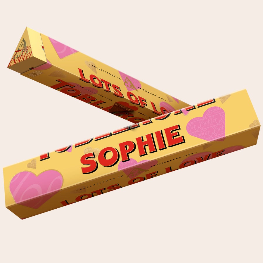 Personalised Toblerone Chocolate Bar - Love Personalized Toblerone bar printed with the name Sophie and Lots of Love surrounded by pink and gold hearts.