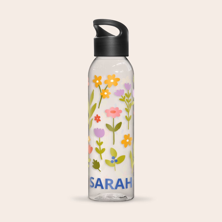 Personalized water bottle printed with a colorful floral design and the name Sarah