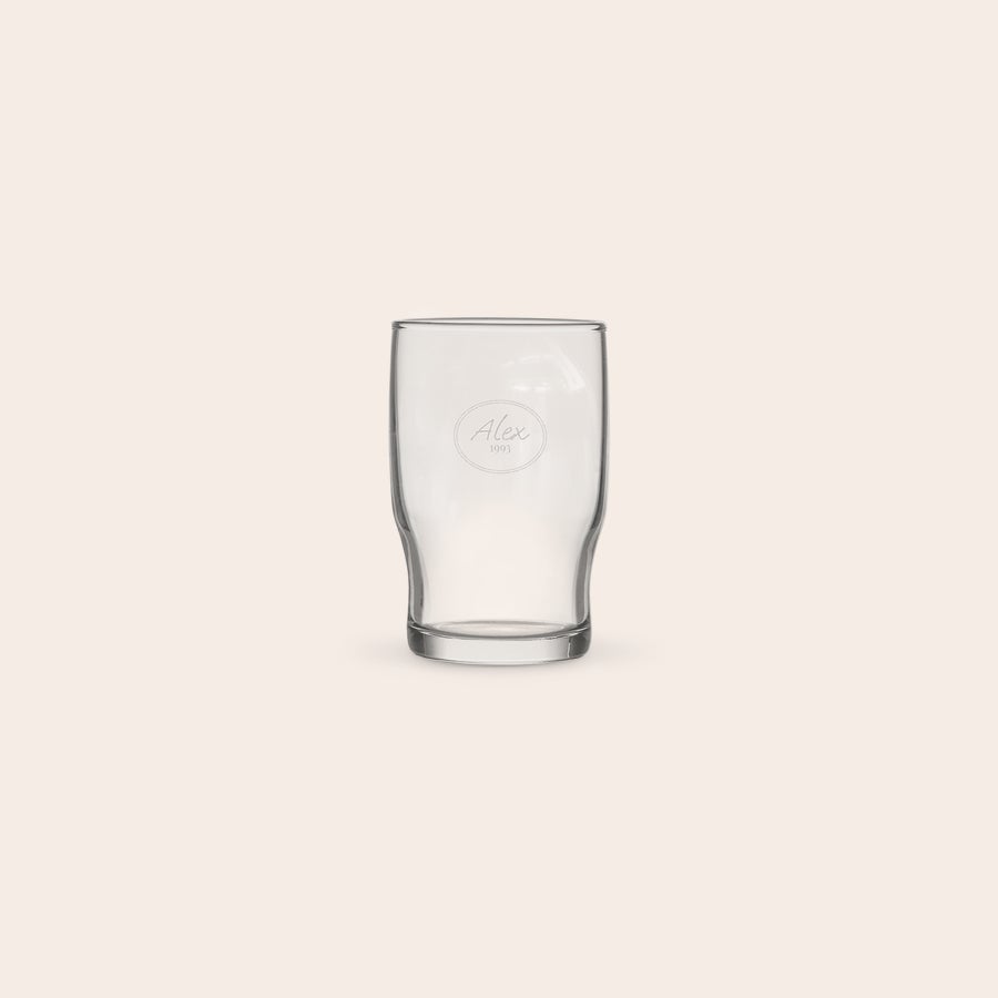 Personalised water glass A personalized water glass with the name Alex engraved within a circle design