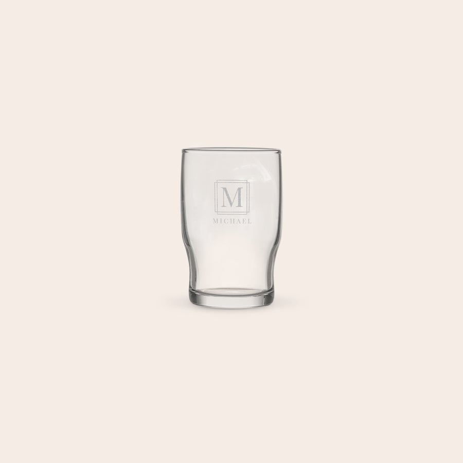Personalised water glass A personalised water glass engraved with the initial M and name Michael for custom drinks